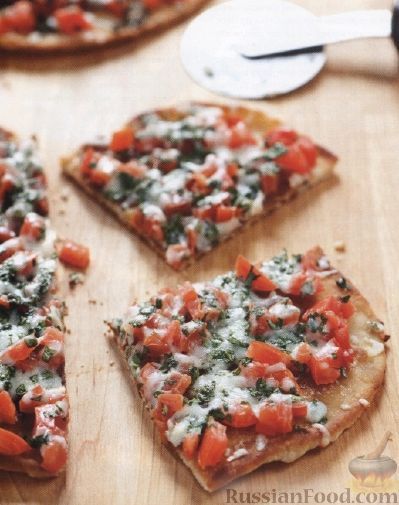 Фото к рецепту: Пицца с помидорами на сковороде